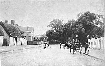 Around 1900. Old thatched cottages, junction Aylesbury Street and Victoria Road, looking south.