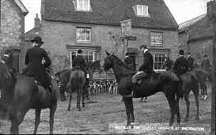 Meet of the Oakley Hounds outside the Crown and Castle in the 1920s or 1930s