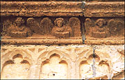 Row of angels in decorative frieze above doorway