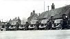 The first fleet of 5 ton lorries of Haynes's C.1930 - Note the thatched cottages behind